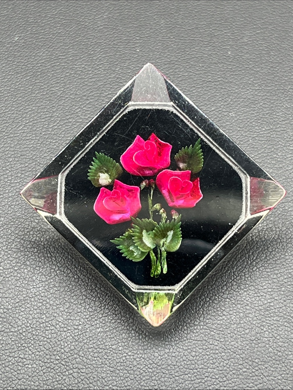 Vintage carved lucite floral brooch bright flowers with black background